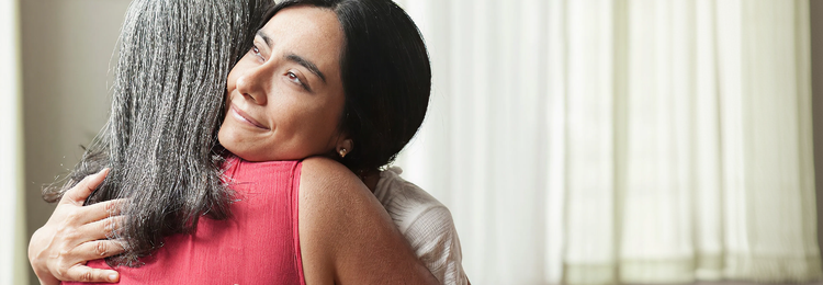 Two women hugging