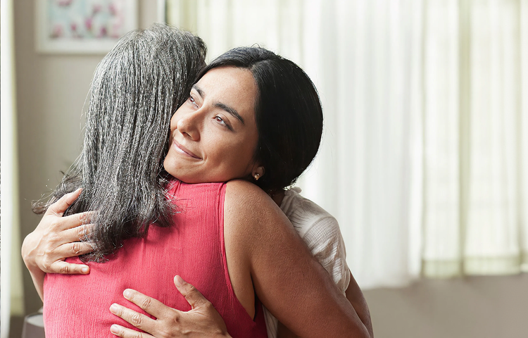 Two women hugging