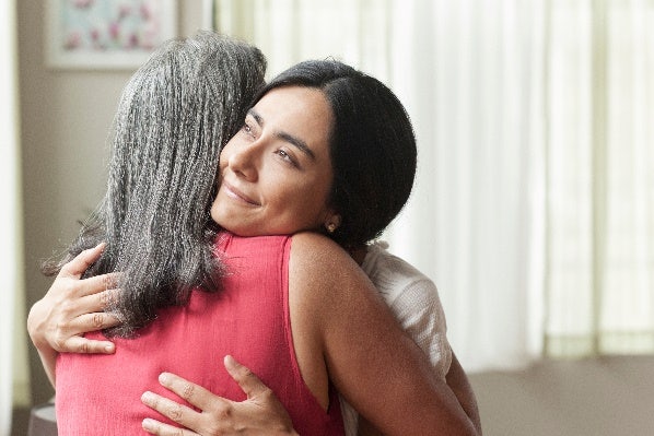Two women hugging